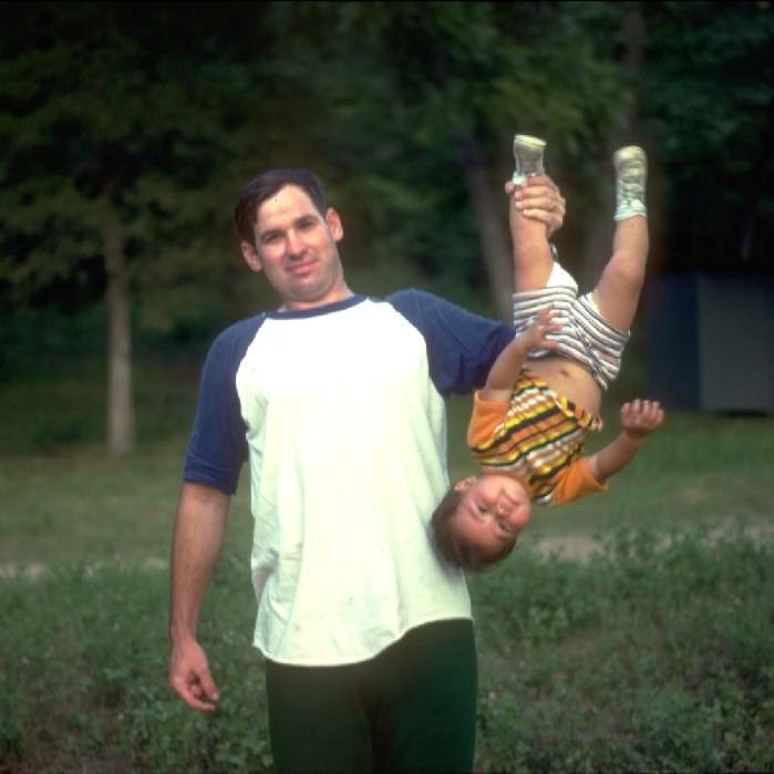 Chris holding Simon ~ like a frog ~ in 1978