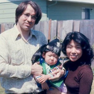 Kim and Chris holding Zachary at 100 days old / 1975