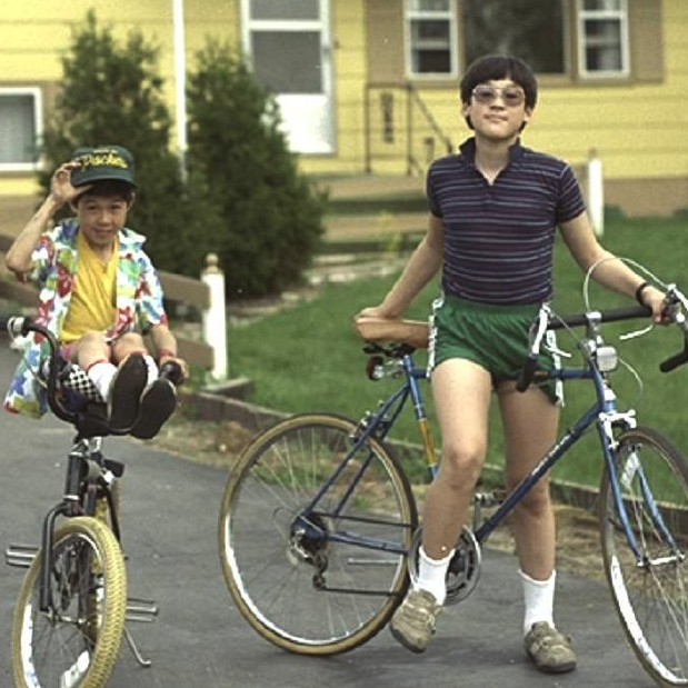 Peter and Zachary on bikes in front of Tomah house ~ 1987