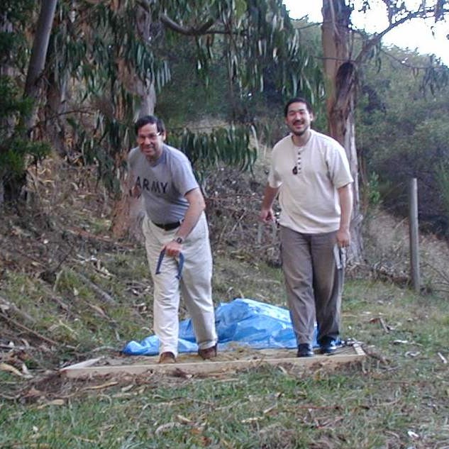 Chris & Zach with horseshoes behind house ~ 2003