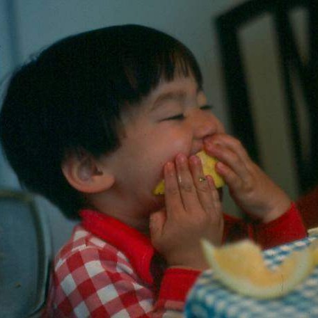 Zachary eating a grapefruit in 1976